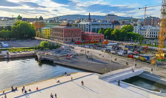 Busy city with flowing river in Norway