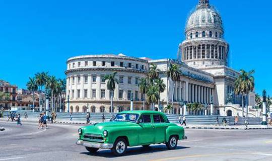 Classic Green American car in Cuban street